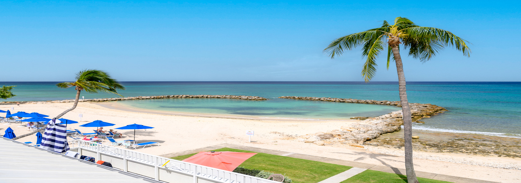 Sunset Cove beach and stone-bordered swimming area
