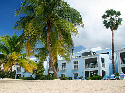 Condo exterior looking up from the sandy beach