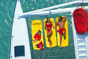 Couple lounging on Catamaran