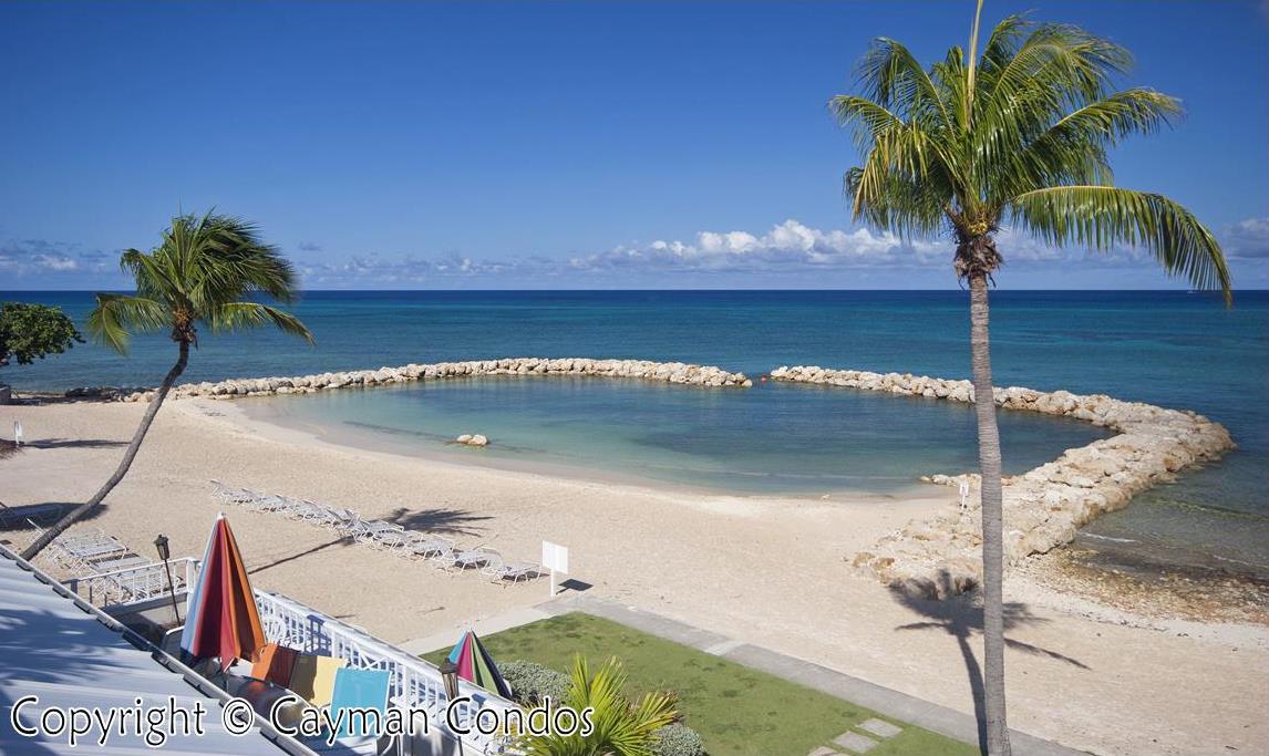 Sunset Cove beach and stone-bordered swimming area